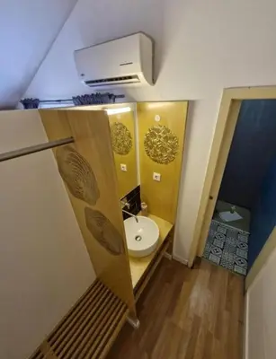 a bathroom with a toilet and a sink at Pink Yellow Porto Apart in Porto
