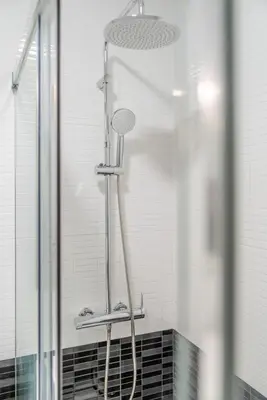a shower in a bathroom next to a window at Duplex Studio in Art District by HostWise in Porto
