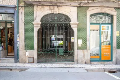 an entrance to a building with an iron gate at Bright 1BR with Parking in Bolhão by LovelyStay in Porto