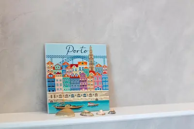 a book sitting on top of a shelf with shells at Morro Flat w Terrace by LovelyStay in Vila Nova de Gaia
