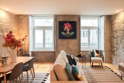 a living room with a couch and a table at Luxury Style 20 with AC Downtown Porto near Metro in Porto