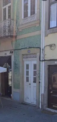 a building with a white door on a street at Blue Orange Porto Apart in Porto