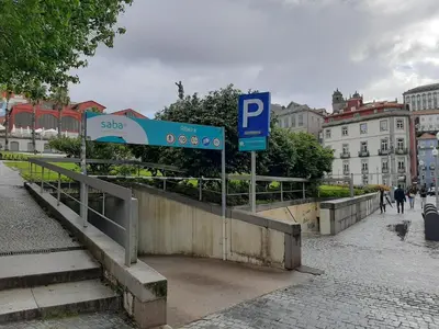 a blue parking sign on a bridge in a city at São João by Casa de Gondomil in Porto