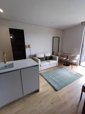 a living room with a couch and a table at Blue River - Douro Tower in Vila Nova de Gaia