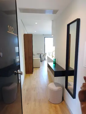 a living room with a mirror and a table at Blue River - Douro Tower in Vila Nova de Gaia