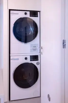 two microwaves stacked on top of each other at My Home is Yours in Porto