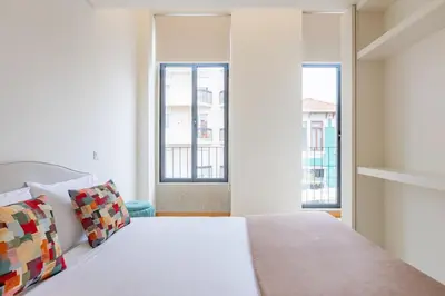 a living room with a couch and a tv at Urban Style in Bonfim | Porto in Porto