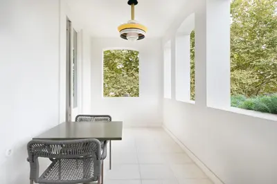 a dining room with a table and two chairs at City Retreat by Reframe stay in Porto in Porto