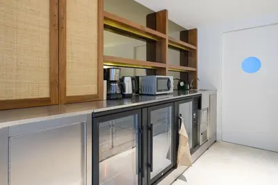 a kitchen with a counter with microwaves and appliances at City Retreat by Reframe stay in Porto in Porto