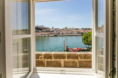 a bathroom with a sink and a mirror at Porto River in Porto