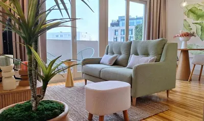 a living room with a couch and a plant at Oporto Hideaway 3 - Poveiros Square Balcony in Porto