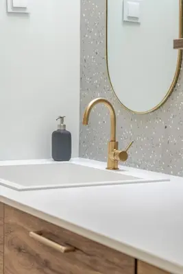 a bathroom with a sink and a mirror at Stylish Open-Plan Flat with Swimming Pool by HostWise in Porto
