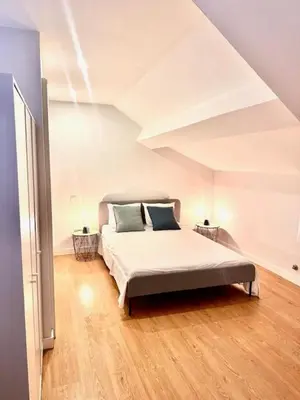 a bedroom with a large bed in an attic at Douro Villa 2 -Best View in Town in Vila Nova de Gaia