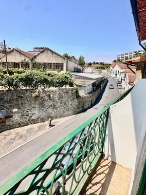 a green railing on a bridge over a street at Douro Villa 2 -Best View in Town in Vila Nova de Gaia