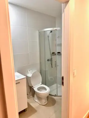 a bathroom with a toilet and a glass shower at Douro Villa 2 -Best View in Town in Vila Nova de Gaia