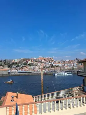 a view of a river with boats in a city at Douro Villa 2 -Best View in Town in Vila Nova de Gaia