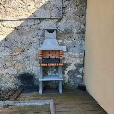 a small stool sitting next to a brick wall at Douro Villa 2 -Best View in Town in Vila Nova de Gaia
