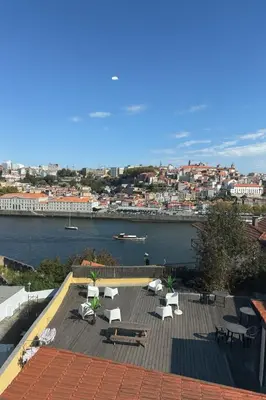 a rooftop with a view of a river and buildings at Douro Villa 2 -Best View in Town in Vila Nova de Gaia