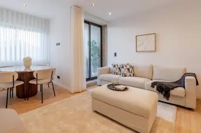 a living room with a couch and a table at Urban Terrace & Stylish Living Spaces by HostWise in Porto