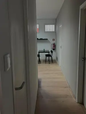 an empty hallway with a table and a dining room at Casa Carvalho Guest House Porto in Porto