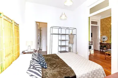 a bedroom with a bed with two pillows on it at Ai Porto! Family 3 in Porto