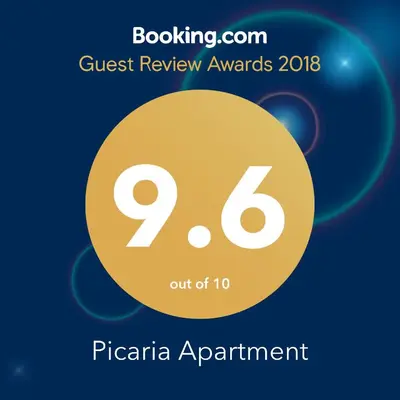 a sign that reads guest review awards pacaria appointment with a yellow circle at Picaria Apartment in Porto