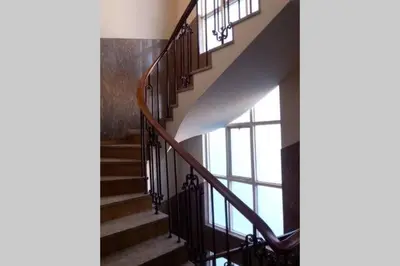 a staircase in a building with glass windows at Picaria Apartment in Porto