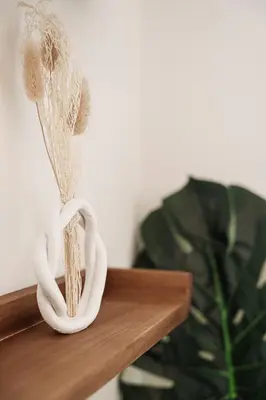 a couple of white knick knacks in a heart holder at Stylish Retreat in Central Porto Stay with Parking in Porto