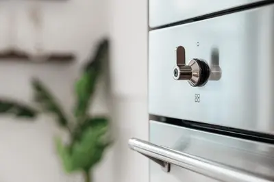 a close up of an oven with a knob at Stylish Retreat in Central Porto Stay with Parking in Porto