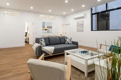 a living room with a couch and a table at Open-Plan Apartment in Downtown Porto by HostWise in Porto