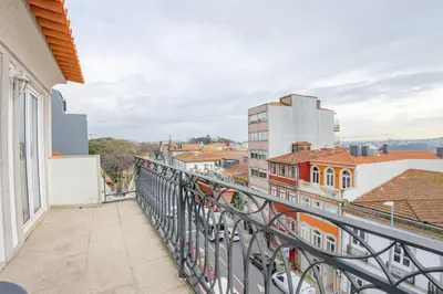 a balcony with a view of a city at Belas Artes Apartments in Porto