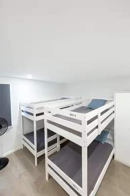 a white bunk bed with a desk in a room at Douro Villa 13 - Best View in Town in Vila Nova de Gaia