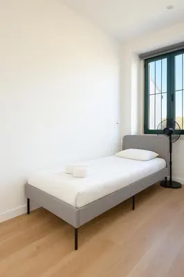 a bed in a white room with a window at Douro Vila 10 - Best View in Town in Bandeira