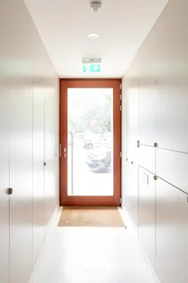 a hallway with a door with a car outside at Modern & Bright Flat in Cedofeita by HostWise in Porto