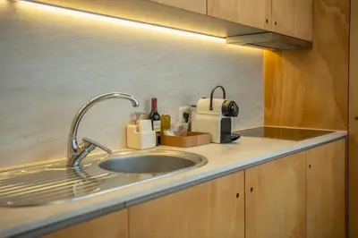 a kitchen counter with a sink and a mixer at The Medievel in Porto