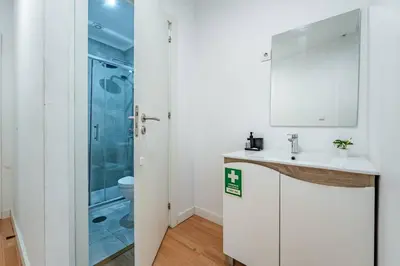a bathroom with a shower and a sink at Oporto Maria Pia Apartment Whith Terrace 2 in Porto