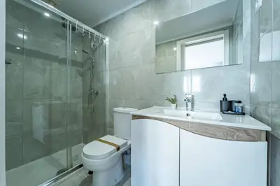 a bathroom with a toilet and a sink and a shower at Oporto Maria Pia Suite 3 in Porto