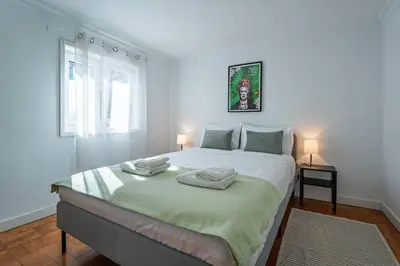 a bedroom with a large bed with two towels on it at Oporto Maria Pia With Terrace Suite 4 in Porto