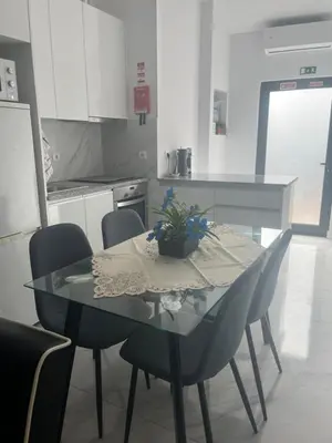 a dining room table and chairs in a kitchen at Candal house in Vila Nova de Gaia