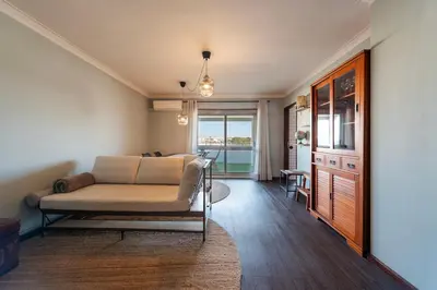 a living room with a couch and a table at NEW! The Porto Wine Cellars Penthouse in Vila Nova de Gaia