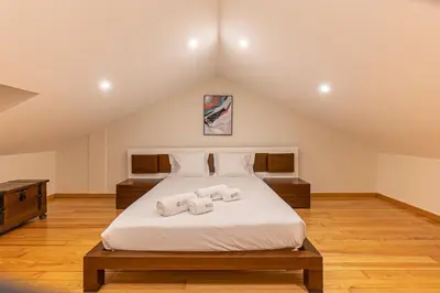 a bedroom with a bed with two towels on it at GuestReady - Porto stay with homely touches in Porto