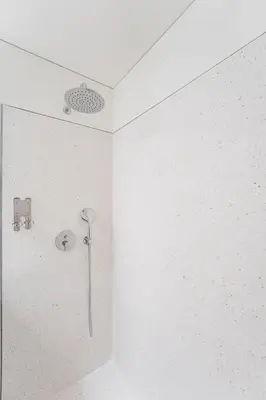 a shower in the corner of a bathroom at GuestReady - DPV GuestHouse - Apart 6 in Porto