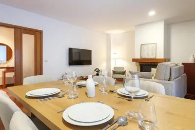 a microwave oven sitting on a counter with a book at ON Apartments - Family Retreat in Porto