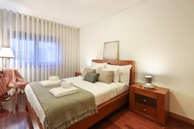 a living room with a couch and a fireplace at ON Apartments - Family Retreat in Porto