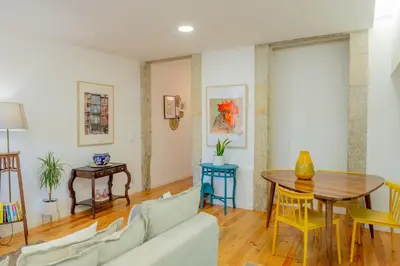 a living room with a couch and a table at VIVA República Serviced Apartment in Porto