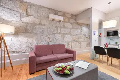 a living room with a couch and a table at ON Apartments - Free Parking & Pet Friendly in Porto
