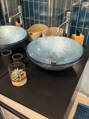 a bathroom with two sinks and a blue bowl at CreaConfort Casa Boa Jóia de Campanhã in Porto