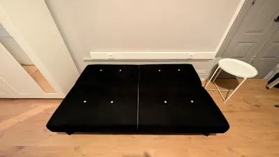 a black coffee table in a room with a chair at Riko Guest House 2 in Porto