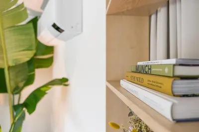 a stack of books sitting on a shelf at DPV Residences - Studio CA/C1 in Porto