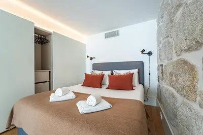 a bathroom with a shower with blue and black tiles at Nomads Lux - 1BD The Comfort Square in Porto in Porto